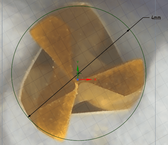 Microscope view of the same Crown Down carbide drill after the accelerated wear run, showing the full three-flute cutting geometry with the 4 mm drill diameter marked.