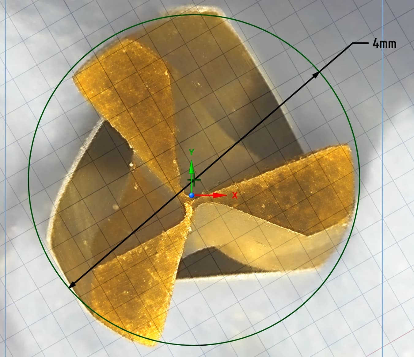 Microscope view of the same Crown Down carbide drill after the accelerated wear run, showing the full three-flute cutting geometry with the 4 mm drill diameter marked.